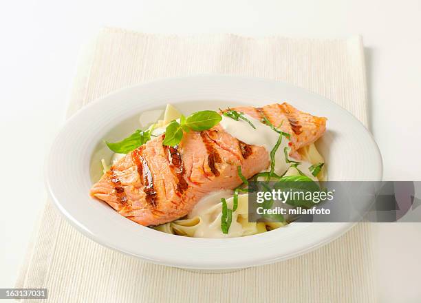 salmon steak with basil and cream sauce - baked salmon stock pictures, royalty-free photos & images