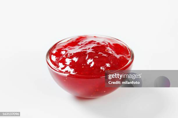 strawberry jam in a glass bowl - preserves stockfoto's en -beelden