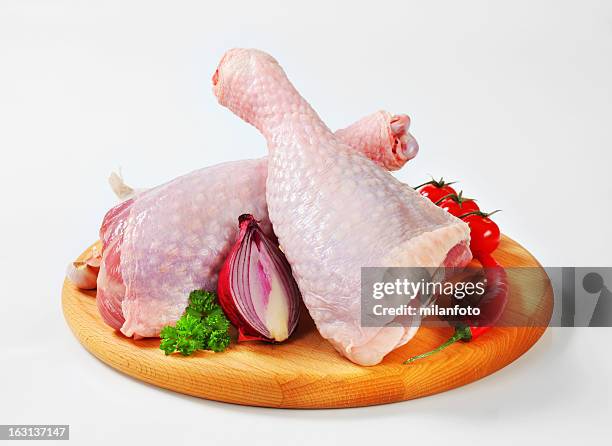 raw turkey legs on a cutting board - turkey leg stock pictures, royalty-free photos & images