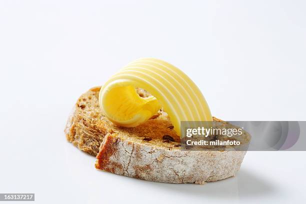 slice of bread with butter - bread butter stock pictures, royalty-free photos & images