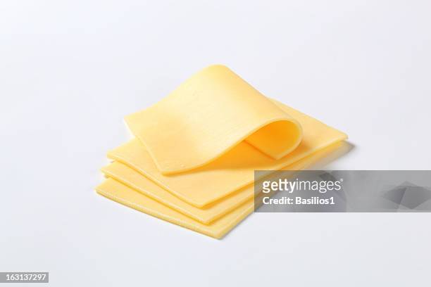 four cut up slices of cheese isolated on a white background - ost bildbanksfoton och bilder