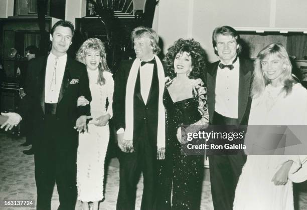 Actor Michael Vader, wife, Peter Holm, Joan Collins, Jack Coleman and date attending 43rd Annual Golden Globe Awards on January 24, 1986 at the...