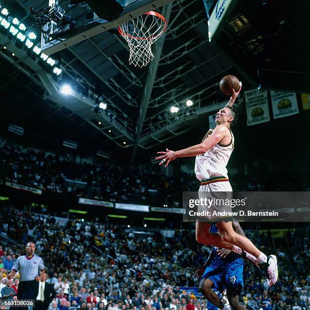 Detlef Schrempf of the Seattle Supersonics dunks against the Minnesota Timberwolves in Game Five of the Western Conference Quarterfinals as part of...