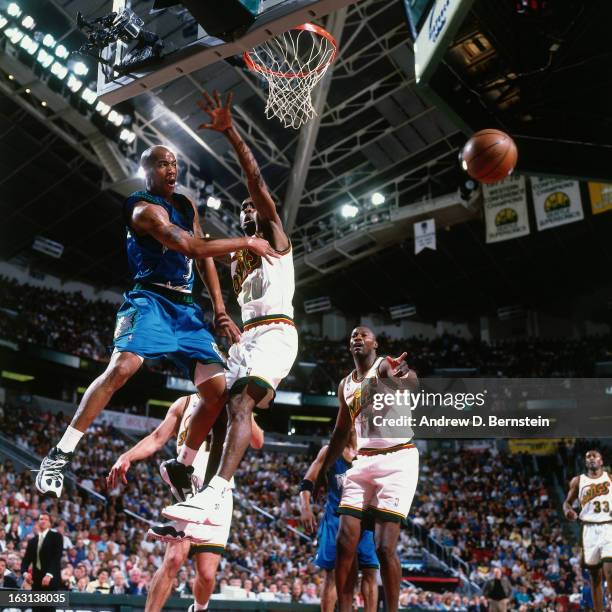 Stephon Marbury of the Minnesota Timberwolves passes against the Seattle Supersonics in Game Five of the Western Conference Quarterfinals as part of...