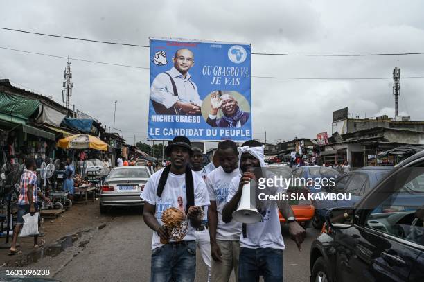 Supporters of Michel Gbagbo , the son of the former Ivorian president Laurent Gbagbo, campaign in Yopougon, a popular district of Abidjan on August...