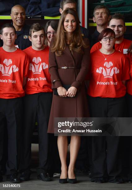 Catherine, Duchess of Cambridge poses for a photograph as she visits Humberside Fire and Rescue during an official visit to Grimsby on March 5, 2013...