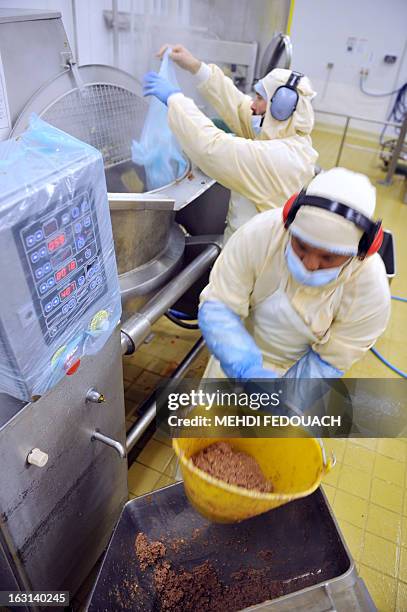 An employee of French ready made meals company "Delpeyrat Traiteur" works on the preparation of hachis parmentier with beef meat on March 4, 2013 in...