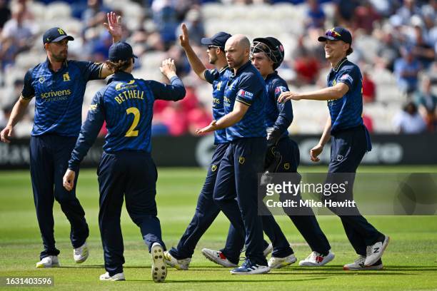 Jake Lintott of Warwickshire celebrates with team mates after dismissing Tom Alsop of Sussex during the Metro Bank One Day Cup match between Sussex...