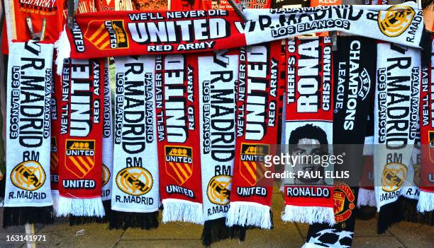 Picture shows scarves and souvenirs on display at a stall ahead of the UEFA Champions League round of 16 second leg football match between Manchester...