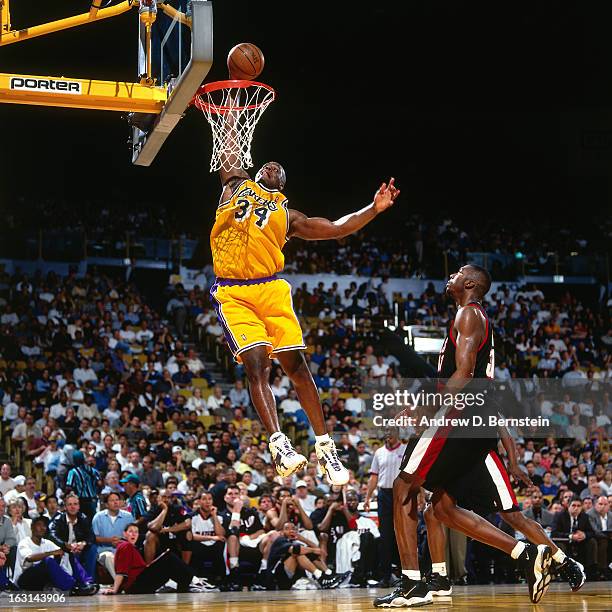 Shaquille O'Neal of the Los Angeles Lakers dunks against the Portland Trail Blazers in Game Two of the Western Conference Quarterfinals as part of...