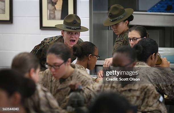 Drill Instructor Sgt. Chasitie Chambers from Bear, Delaware speaks to her female Marine recruits in the chow hall during boot camp February 26, 2013...