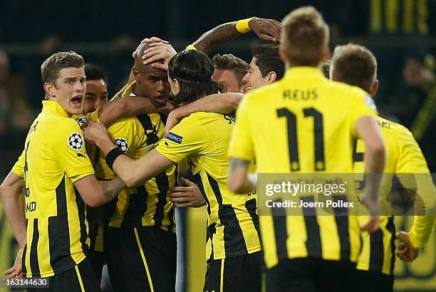 Felipe Santana of Dortmund celebrates with his team mates after scoring his team's first goal during the UEFA Champions League round of 16 leg match...