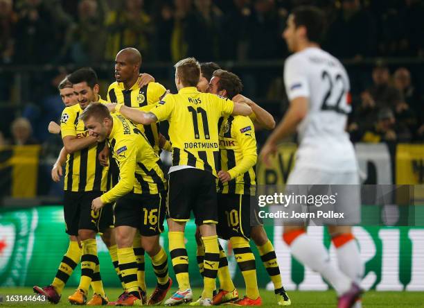 Felipe Santana of Dortmund celebrates with his team mates after scoring his team's first goal during the UEFA Champions League round of 16 leg match...