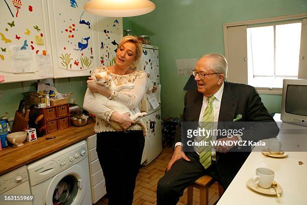 Rendezvous With Jean-Marie Le Pen And His Daughter Marine. Attitude souriante de Jean-Marie LE PEN assis auprès de sa fille Marine un chat dans les...