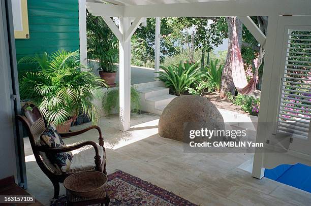 Close-Up Of Patrick Demarchelier French Fashion Photographer. Maison de Saint-Barthélemy : grosse pierre en apparence au milieu du patio de la...