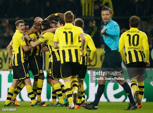 Felipe Santana of Dortmund celebrates with his team mates after scoring his team's first goal during the UEFA Champions League round of 16 leg match...