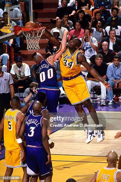 Shaquille O'Neal of the Los Angeles Lakers dunks against the Utah Jazz in Game Three of the Western Conference Semifinals as part of the 1998 NBA...