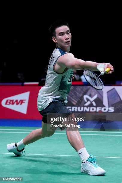 Kantaphon Wangcharoen of Thailand competes in the Men's Singles Second Round match against Li Shifeng of China on day two of the BWF World...