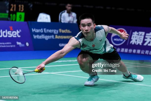 Kantaphon Wangcharoen of Thailand competes in the Men's Singles Second Round match against Li Shifeng of China on day two of the BWF World...