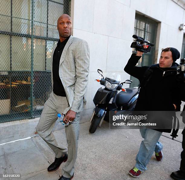 Player Lamar Odom arrives to attend a custody hearing with ex-girlfriend Liza Morales at New York State Supreme Court on March 5, 2013 in New York...