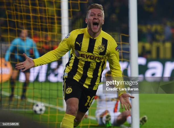 Jakub Blaszczykowski of Dortmund celebrates after scoring his teams third goal during the UEFA Champions League round of 16 second leg match between...
