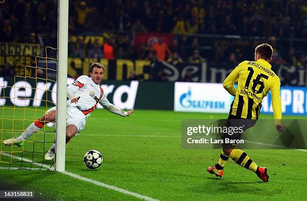 Jakub Blaszczykowski of Dortmund scores his teams third goal during the UEFA Champions League round of 16 second leg match between Borussia Dortmund...