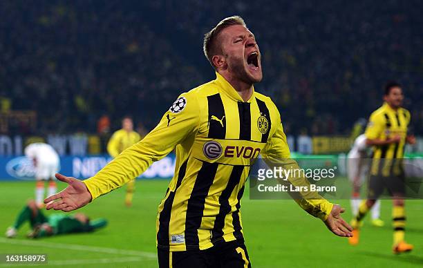 Jakub Blaszczykowski of Dortmund celebrates after scoring his teams third goal during the UEFA Champions League round of 16 second leg match between...
