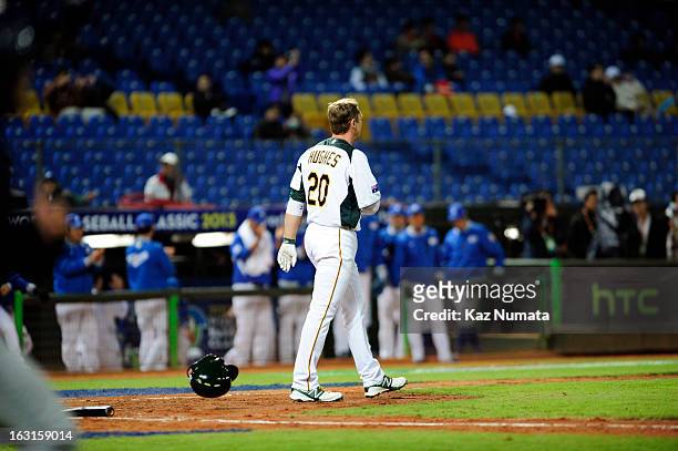Luke Hughes of Team Australia reacts to striking out to end the fifth inning during Pool B, Game 4 between Team Korea and Team Australia during the...