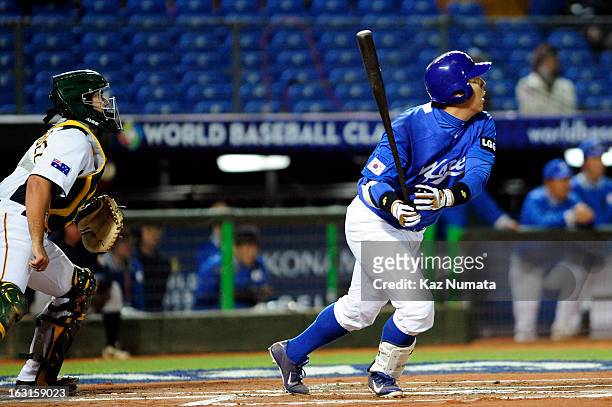 Hyunsoo Kim of Team Korea hits a two run RBI single in the top of the first inning during Pool B, Game 4 between Team Korea and Team Australia during...