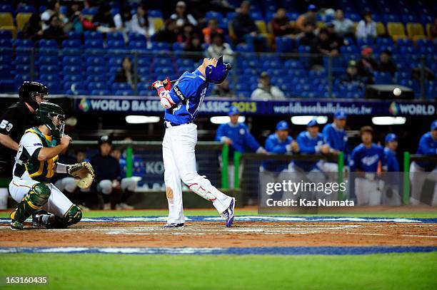 Jeong Choi of Team Korea is hit by pitch in the top of the third inning during Pool B, Game 4 between Team Korea and Team Australia during the first...