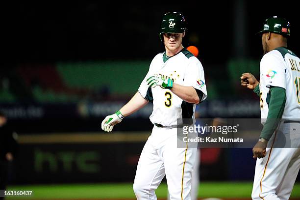 Mike Walker of Team Australia singles in the bottom of the fourth inning during Pool B, Game 4 between Team Korea and Team Australia during the first...