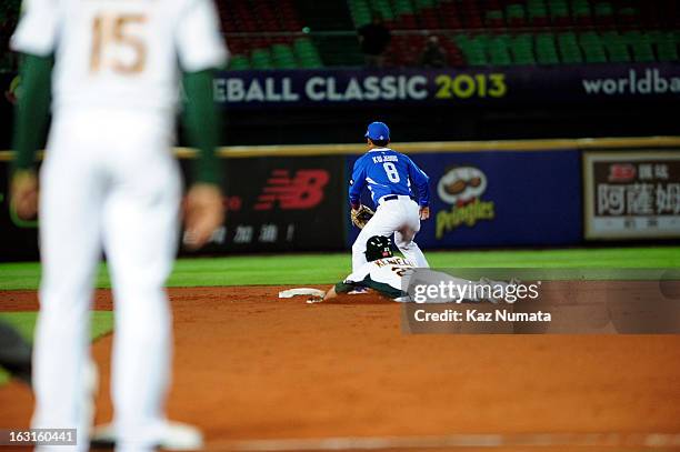 Tim Kennelly of Team Australia slides safely into second base with a double in the bottom of the fifth inning during Pool B, Game 4 between Team...