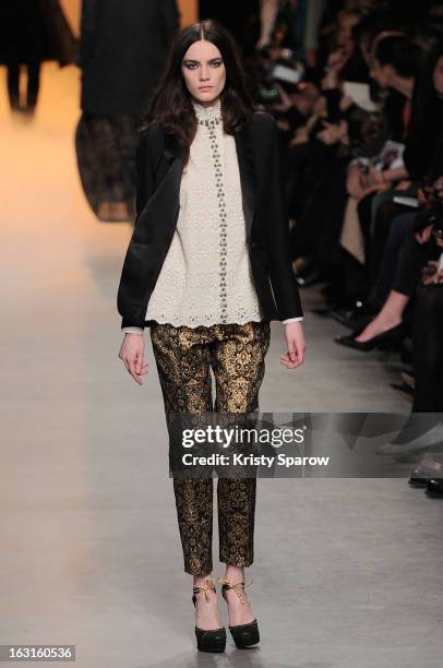 Model walks the runway during the Paul & Joe Fall/Winter 2013/14 Ready-to-Wear show as part of Paris Fashion Week on March 5, 2013 in Paris, France.