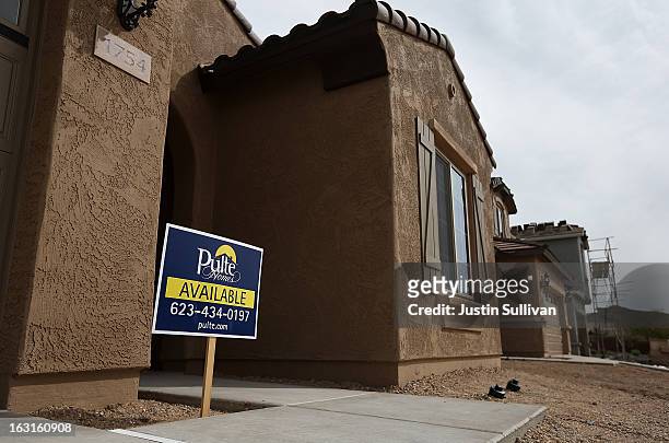 An sign is posted in front of a new home at the Pulte Homes Fireside at Norterra-Skyline housing development on March 5, 2013 in Phoenix, Arizona. In...