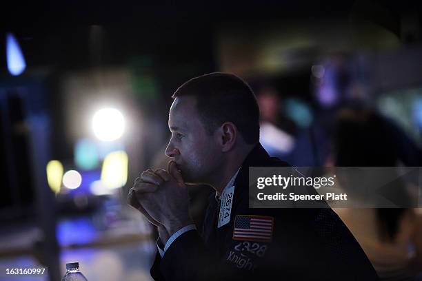 Traders work on the floor of The New York Stock Exchange on March 5, 2013 in New York City. The Dow Jones industrial average rallied to a record high...