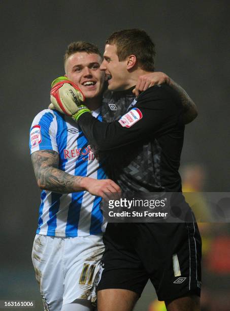 Huddersfield goalkeeper Alex Smithies celebrates with winning goalscorer Danny Ward on the final whistle after Town had come from behind to win 2-1...