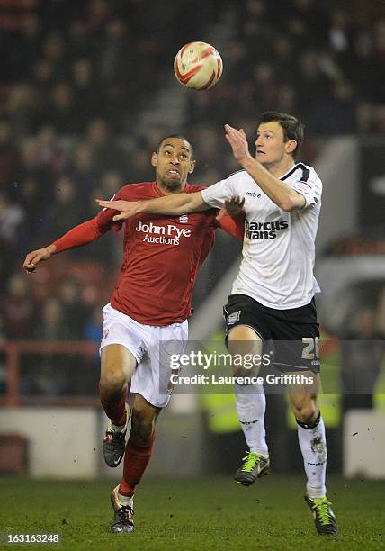 Dexter Blackstock of Nottingham Forest and Tommy Smith of Ipswich compete for a header during the npower Championship match between Nottingham Forest...