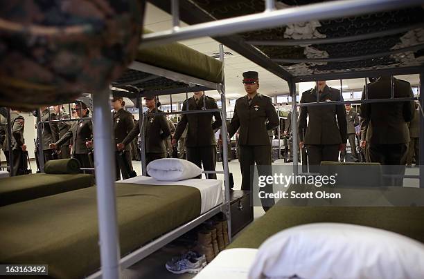 Female Marine recruits stand inspection in the final days of their boot camp training February 26, 2013 at MCRD Parris Island, South Carolina. Female...