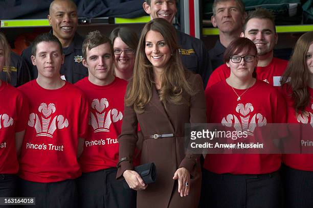 Catherine, Duchess of Cambridge poses for a photograph as she visits Humberside Fire and Rescue during an official visit to Grimsby on March 5, 2013...