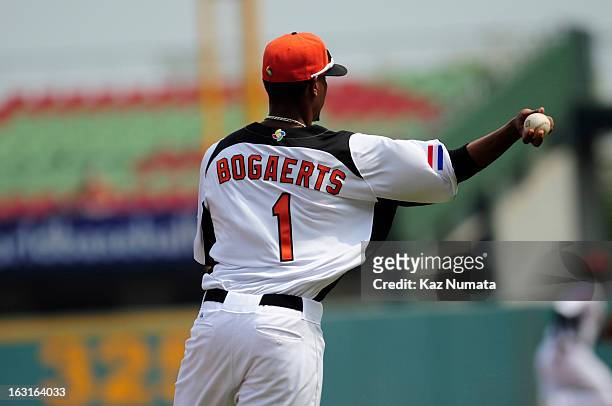 Xander Bogaerts of Team Netherlands throws to first base in the top of the second inning during Pool B, Game 5 between Team Australia and Team...