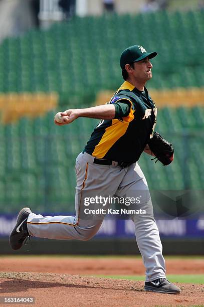 Dushan Ruzic of Team Australiai throws the first pitch of the bottom of the first inning during Pool B, Game 5 between Team Australia and Team...