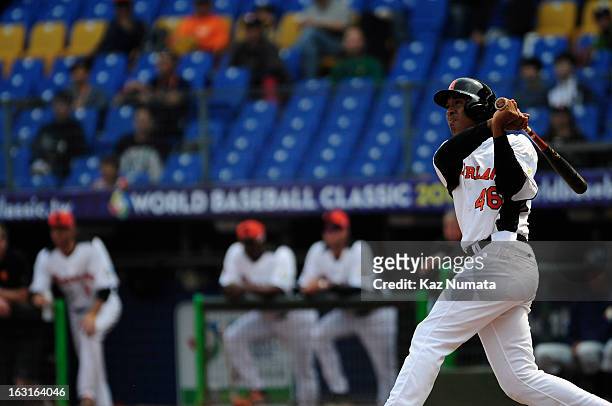 Jonathan Schoop of Team Netherlands hits a two run home run in the bottom of the second inning during Pool B, Game 5 between Team Australia and Team...