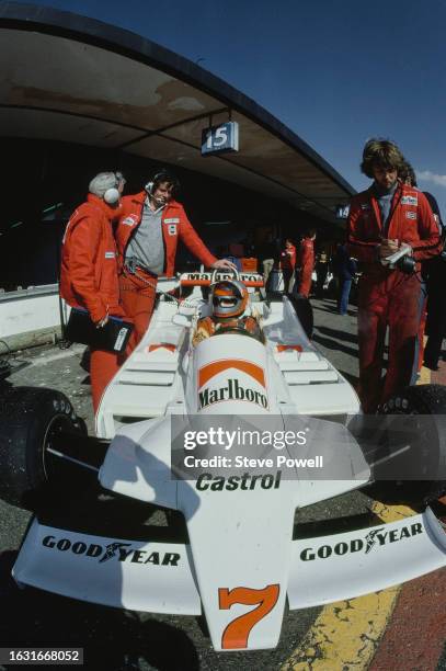 John Watson from Great Britain sits aboard the Marlboro Team McLaren McLaren M28 Ford Cosworth DFV V8 in the pit lane during practice for the Formula...