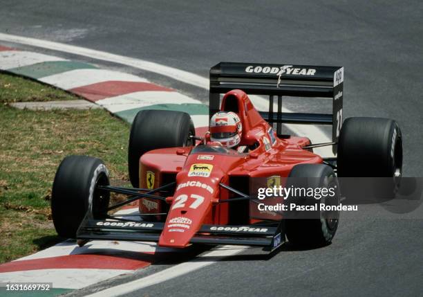 Nigel Mansell from Great Britain drives the Scuderia Ferrari Ferrari 640 V12 over the curb during the Formula One Mexican Grand Prix on 28th May 1989...