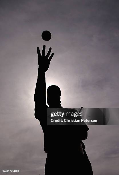 Ryan Braun of Team USA throws an autographed ball up to fans before the spring training game against the Chicago White Sox at Camelback Ranch on...