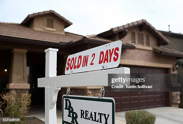 Sold sign is posted in front of a home on March 5, 2013 in Phoenix, Arizona. In 2008, Phoenix, Arizona was at the forefront of the U.S. Housing...