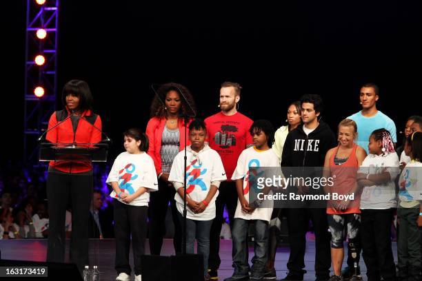 First Lady of the United States Michelle Obama, speaks as athletes Serena Williams, Bob Harper, Allyson Felix, Paul Rodriguez, Sarah Reinertsen,...