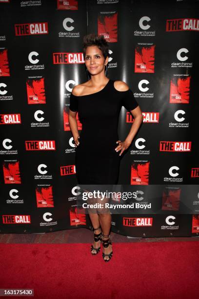 Actress Halle Berry, poses for photos on the red carpet prior to the movie screening of her film, "The Call" at the Showplace ICON Theaters in...