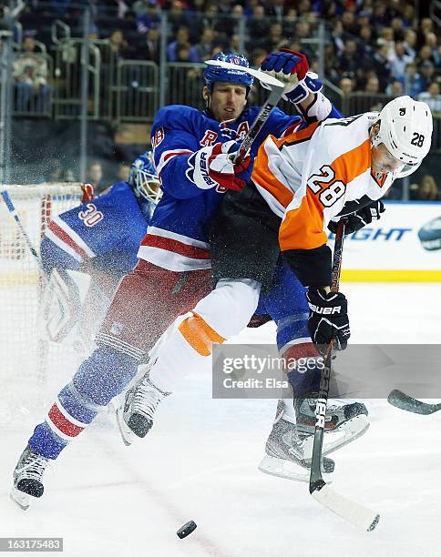 Claude Giroux of the Philadelphia Flyers and Micheal Haley of the New York Rangers collide on March 5, 2013 at Madison Square Garden in New York City.