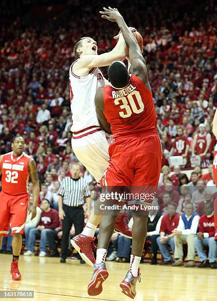 Cody Zeller of the Indiana Hoosiers shoots the ball while defended by Evan Ravenel of the Ohio State Buckeyes during the game at Assembly Hall on...